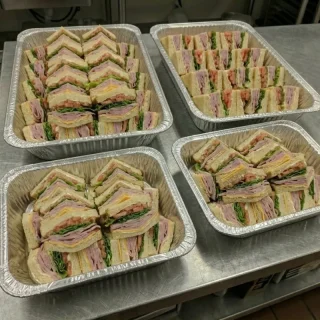 Ham and cheese sandwich catering trays with mayo, lettuce, and tomato from Ally’s Comfort Café in Davie, FL