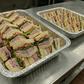 Ham sandwich catering trays with mayo, lettuce, and tomato from Ally’s Comfort Café in Davie, FL