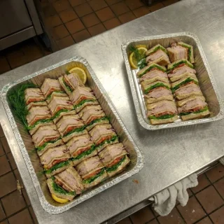 Turkey and cheese sandwich catering trays with mayo, lettuce, and tomato from Ally’s Comfort Café in Davie, FL