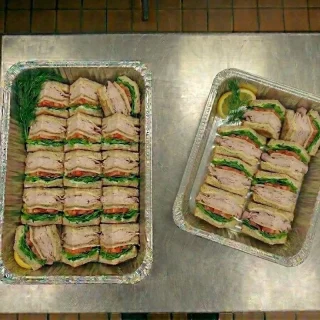 Turkey sandwich catering trays with mayo, lettuce, and tomato from Ally’s Comfort Café in Davie, FL